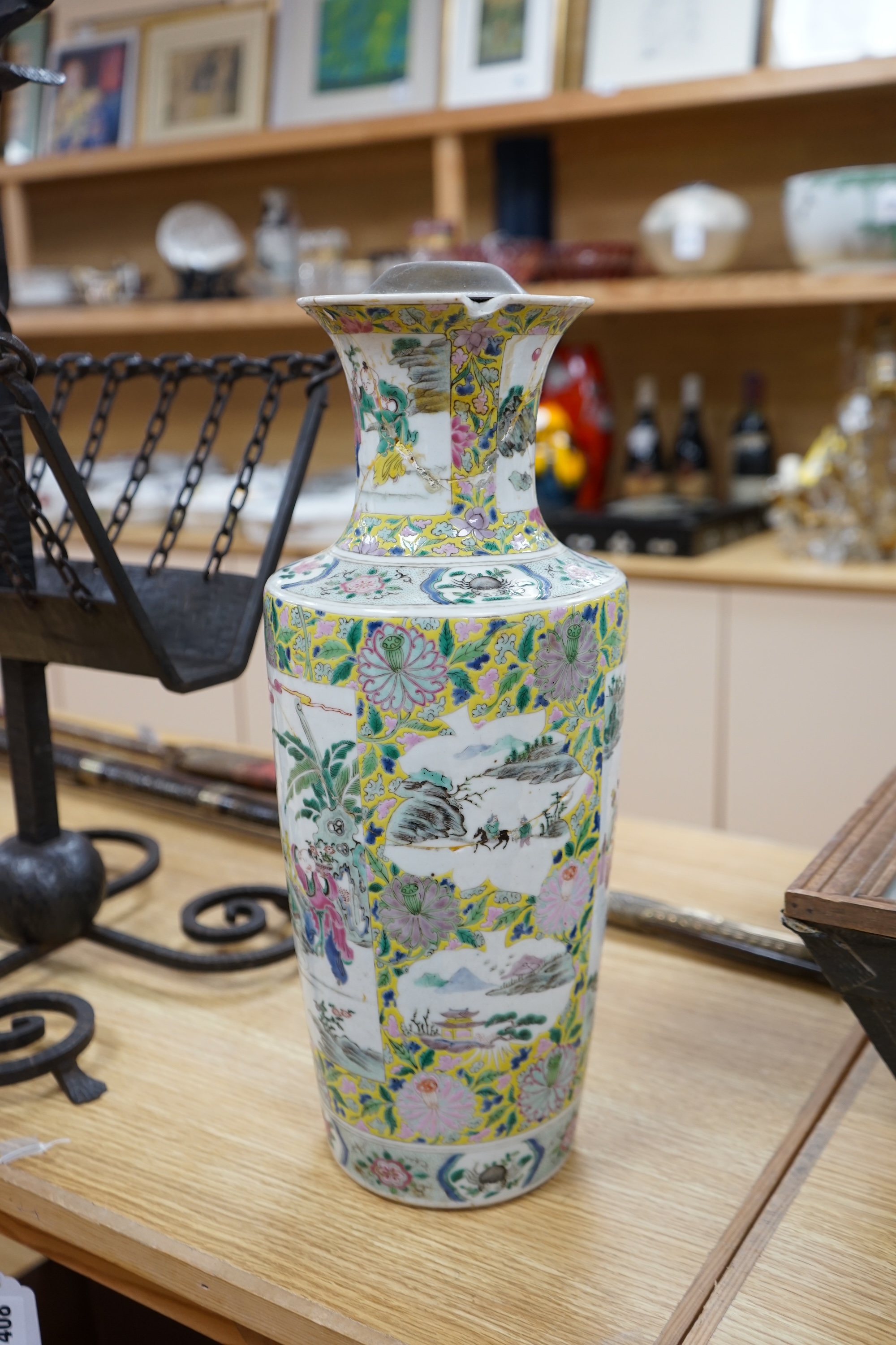 A 19th century Chinese famille rose porcelain vase enamelled with figures and flowers, converted to a lamp base, 43cm high. Condition - poor